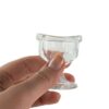 Eye wash cup held in person's hand