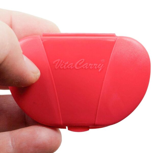 Red Vita Carry Pocket Clamshell Case Closed in Person's Hand