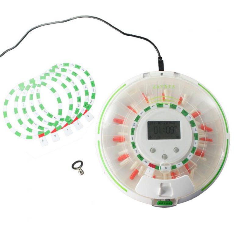 GMS Pill Wifi Automatic Pill Dispenser plugged in with key and six reminder discs