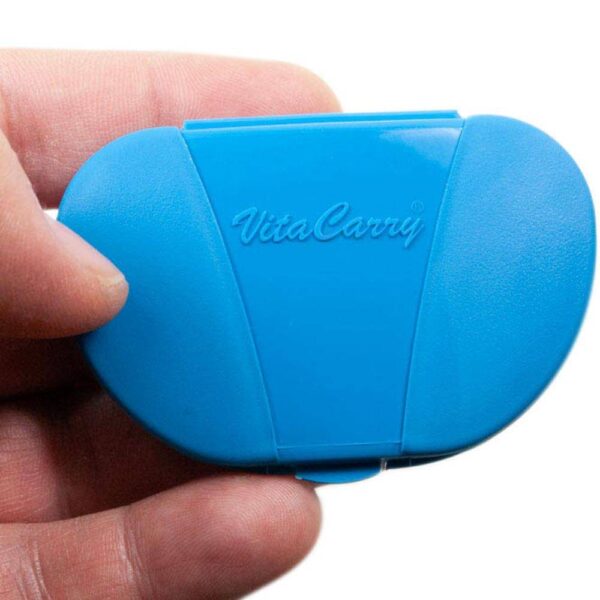 Blue Vita Carry Pocket Clamshell Case Closed in person's hand