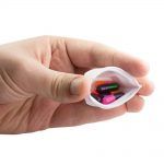 GMS Squeezable Pill Case in Person's Hand