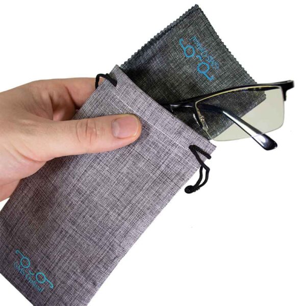 GMS Blue Light Blocking Glasses with hand holding bag filled with glasses and microfiber cloth