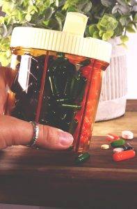 photo of the Vitanizer with pills on counter